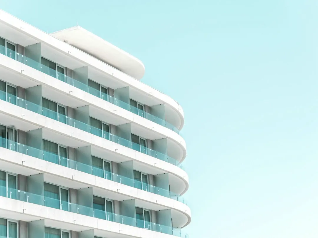 White balconies of an apartment building against the sky